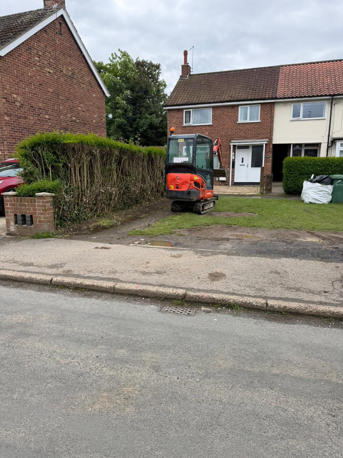 New tarmac drive & drop kerb — before